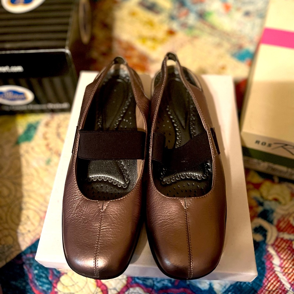 Low heel slip on with sling back.  Comfort and style
